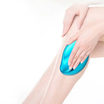 a woman's legs with a blue object on it