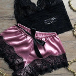 a black and pink lingerie and a necklace