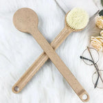 a pair of wooden spoons sitting on top of a white rug