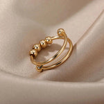 a close up of a gold ring on a white cloth