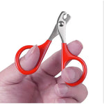 a person holding a pair of scissors in their hand