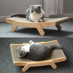 a cat laying on top of a wooden bed