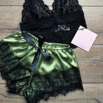 a black and green lingerie with a tag on it