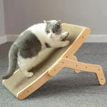 a gray and white cat sitting on top of a wooden chair