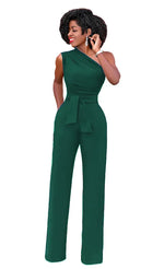 a woman in a green jumpsuit talking on a cell phone