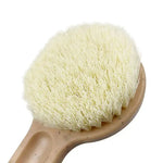 a wooden brush with white bristles on a white background