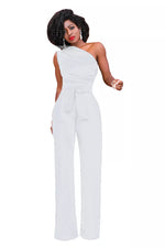 a woman wearing a white jumpsuit with a one shoulder top