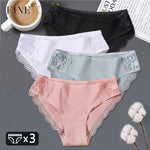 three women's panties with laces and a cup of coffee