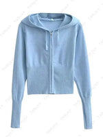 a women's blue sweater with a hoodie