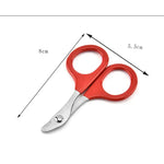 a pair of red scissors on a white background