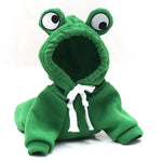 a stuffed frog is wearing a green hoodie