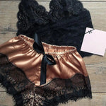 a black and gold lingerie with a tag on it