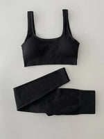 a black sports bra top and leggings