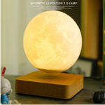 a moon lamp sitting on top of a wooden stand