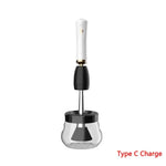 a black and white electric juicer on a white background