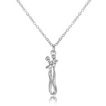 a silver necklace with a small figure on it