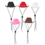 three different colored hats hanging from a string