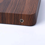 a close up of a wooden object on a white surface